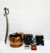 Ornate metal handled cutlass type sword, copper coal scuttle, binoculars and money box