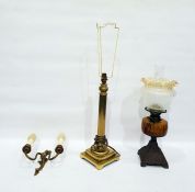 Brass table lamp formed as a Corinthian pillar on stepped base, an electric wall light and a paraff