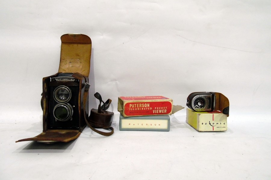 Vintage Voigtlander camera in case, a Sekonic mode