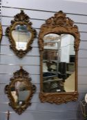 Three wall mirrors, varying shapes, in moulded fra