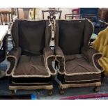 Pair of upholstered wingside easy chairs on squat