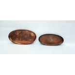 Two oval copper trays, graduated sizes, one emboss