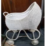 Vintage child's pram in white painted cane