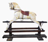 Vintage carved wood child's rocking horse with string mane and tail, reupholstered saddle, on a sta