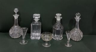 Four various cut glass decanters, two cut stem win