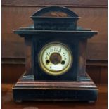 Simulated marble mantel clock in a lacquered oak c