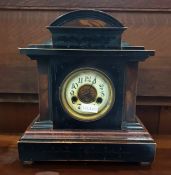 Simulated marble mantel clock in a lacquered oak c