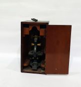 Microscope within a wooden carry box