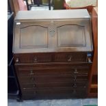 Mid 20th century dark stained bureau in the Jacobe