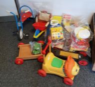 Collection of children's large plastic and other toys to include a scooter, a plastic wheelbarrow,
