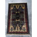 Old Baluchi wool carpet in brown, beige and blue,
