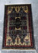 Old Baluchi wool carpet in brown, beige and blue,