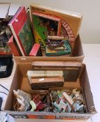 Two boxes of assorted board games, puzzles, cards