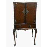 Early 20th century walnut cocktail cabinet with tw
