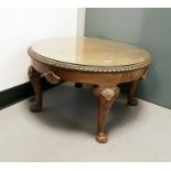 Walnut circular top coffee table with loose glass