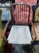 Stained wood framed spindle back open arm chair