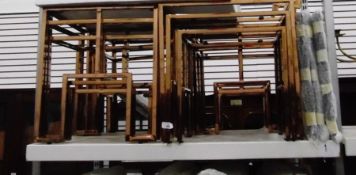 Three rose-coloured metal glass-topped table nests of cube design (3)