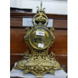 French mantel clock in a gilt metal case, with str