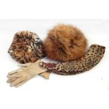 Ocelot fur collar, a pair of kid gloves, a rabbit skin pill box hat dyed to look like leopard and
