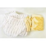 Large cream wool shawl embroidered with yellow thread and a pair of cut and drawn curtains/bedcovers