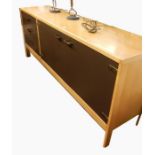 Mid 20th century light and lacquered sideboard, having double doored cupboard, and three drawers