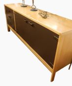 Mid 20th century light and lacquered sideboard, having double doored cupboard, and three drawers