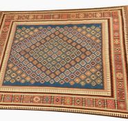 Kelim rug, the blue ground with field of multiple hooked lozenges, geometric  hooked border, in