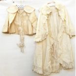 Child's woollen christening cape with ribbon and braid decoration and a long woollen embroidered