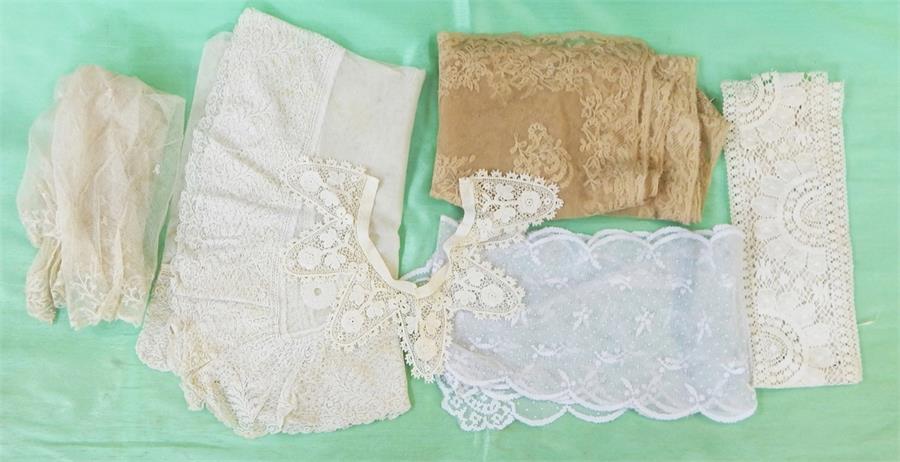 Assorted lace collars, pieces and trimmings, a cobweb shawl with crocheted trim within a vintage
