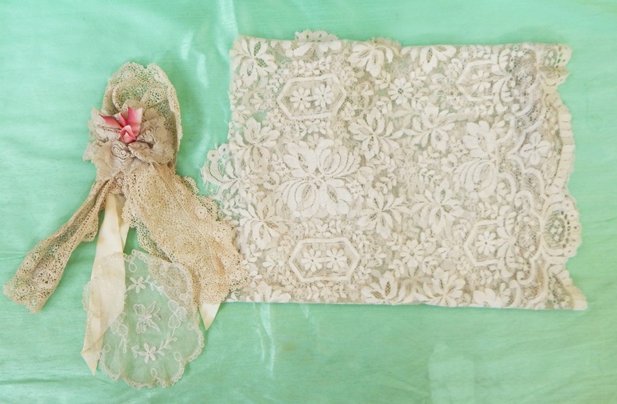Length of bobbin lace with petal edge, possibly from an overskirt, a small section of bobbin lace