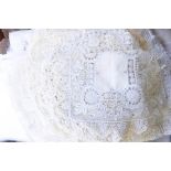 Quantity of assorted table mats, doilies, two damask tablecloths and a linen tablecloth with deep