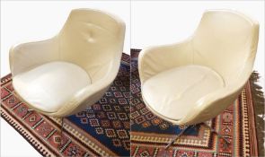 Pair Grassoler Spanish beige leather swivel armchairs, each with removable seat cushion, on chrome