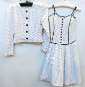 White and black polka dot jacket with black buttons, labelled 'Emmanuel', size 12, a Caroline