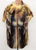 Raccoon gilet coat with cap sleeves and a fox fur and leather hat (2)