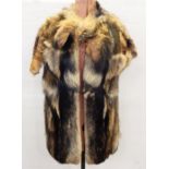 Raccoon gilet coat with cap sleeves and a fox fur and leather hat (2)