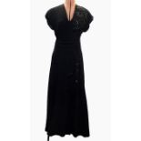 1940's black crepe evening dress with slight train, embroidered on the left shoulder in sequins,