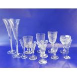 Four late 19th century wines, panelled, on stepped foot, a similar rummer, a cut glass and