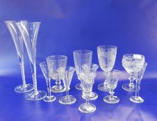 Four late 19th century wines, panelled, on stepped foot, a similar rummer, a cut glass and