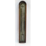 Antique stained wooden cased thermometer with arched top and steel dial, 29cm