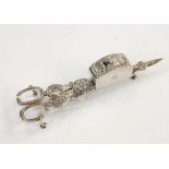 Pair of Georgian silver candle snuffers with shell and flowerhead decoration to the body, the back