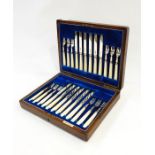 Set of 12 pairs Mappin & Webb silver and mother-of-pearl handled fruit knives and forks, line