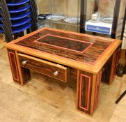 20th century custom made coffee table in Macassar ebony veneer with walnut lippings, leather covered