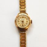 Lady's gold-coloured Accurist wristwatch and the rolled gold flexible strap