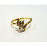 9ct gold and diamond cluster ring, in six pointed star setting