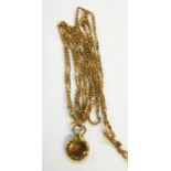 Victorian gold-plated guard chain, ornate link and small glass locket, possibly pinchbeck