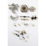 Quantity of silver brooches including Scottish, smoky stone, marcasite bar brooch and a gold bar