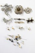 Quantity of silver brooches including Scottish, smoky stone, marcasite bar brooch and a gold bar