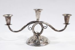 Danish white metal three-branch candelabrum having pair scroll branches and on circular foot, 16cm