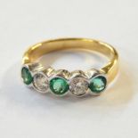 18K gold, emerald and diamond ring set collet-set two diamonds alternating with three emeralds,