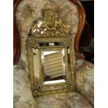 Victorian brass wall mirror in 17th century Flemish style, having scallopshell scroll and fruit